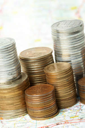 Coins lay on a mapの写真素材