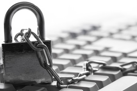 Computer  keyboard secured with chain and padlock