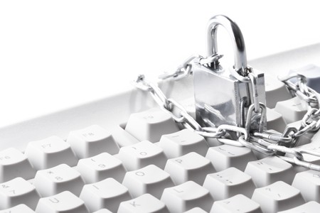 Computer  keyboard secured with chain and padlock

の写真素材