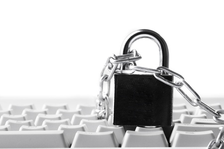 Computer  keyboard secured with chain and padlockの写真素材