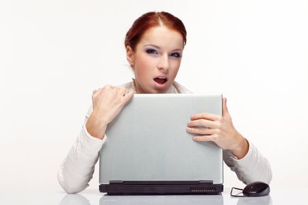 Portrait of happy  business woman with a laptop.の写真素材