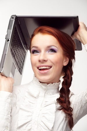 Portrait of happy  business woman with a laptopの写真素材