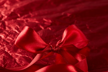 satin ribbons on the red backgroundの写真素材
