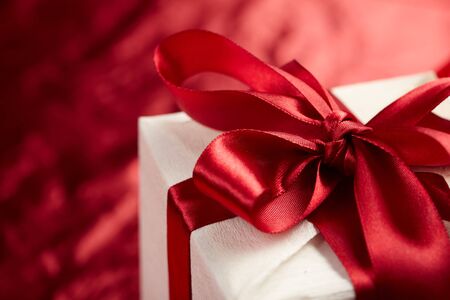  Beautiful gift box on the red backgroundの写真素材