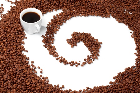 Cup with coffee, costing on coffee grainの写真素材