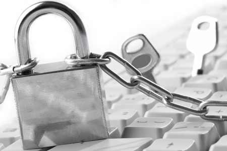 Computer  keyboard secured with chain and padlock

の写真素材