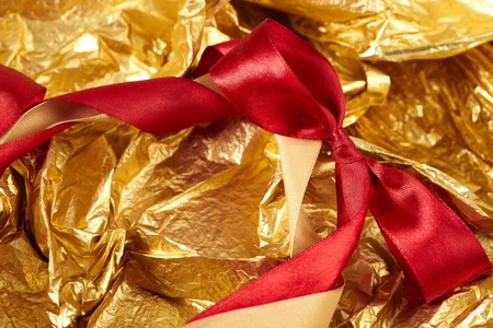 satin ribbons on the gold backgroundの写真素材