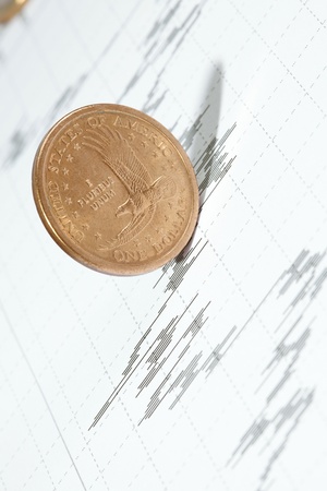 Business diagram on financial report with coins の写真素材