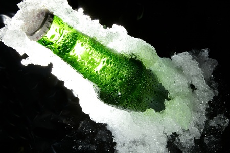 Close up view of the bottle in iceの写真素材