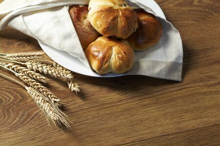 baked bread on wood table の写真素材