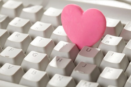 pink heart on the keyboardの写真素材