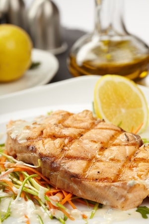 Fish steak with vegetablesの写真素材