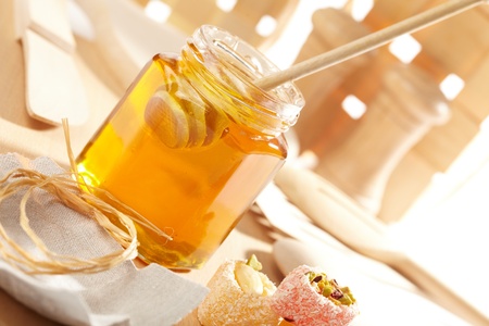 Honey with wood stick の写真素材