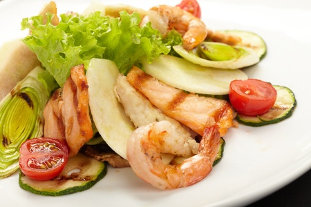 Shrimps with salmon and vegetablesの写真素材