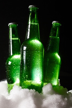 beer bottles in snowの写真素材