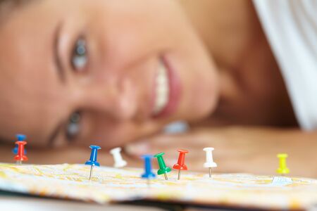 woman  looking at world map の写真素材
