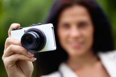 Nice woman taking a photo