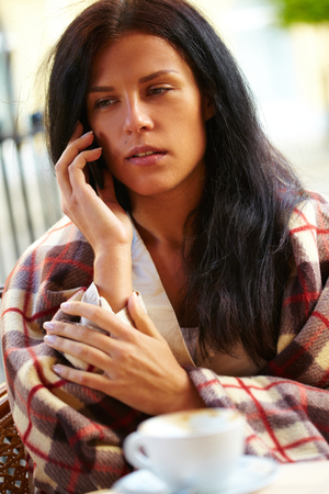 Woman with coffee cupの写真素材