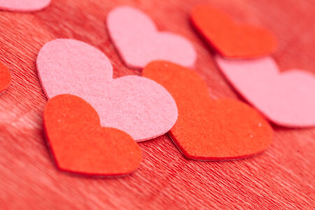 Hearts on red backgroundの写真素材