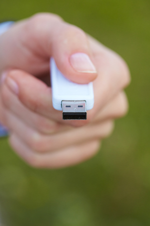 hand holding black USB data storageの写真素材