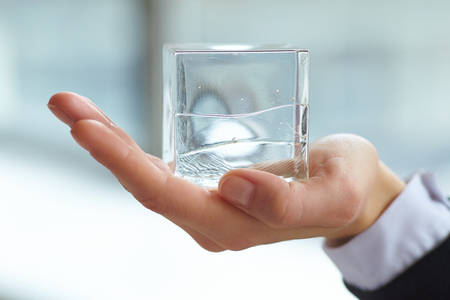 glass cube in the handの写真素材