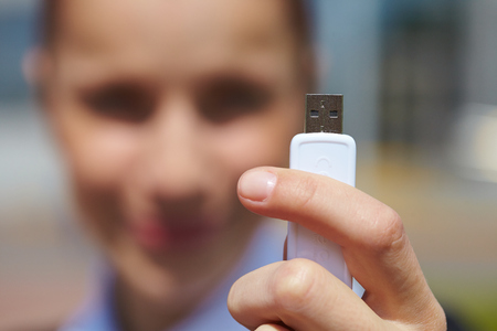 hand holding black USB data storageの写真素材