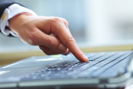  female hands on keyboardの写真素材