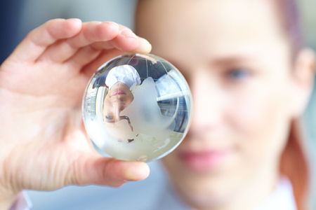 glass ball in the handの写真素材