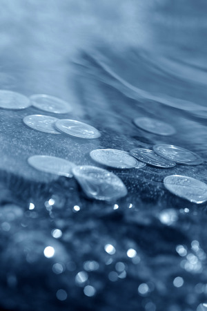coins under waterの写真素材