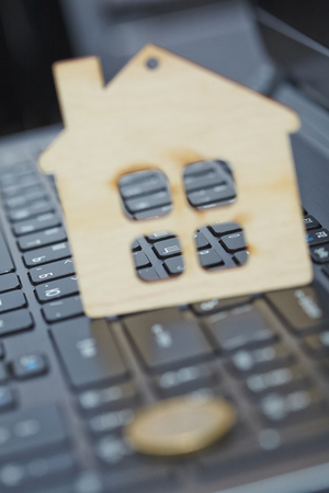 wood house on laptop
