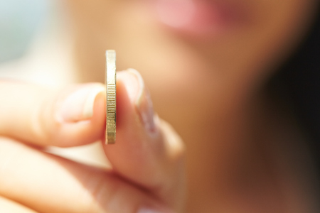 woman handing coinsの写真素材