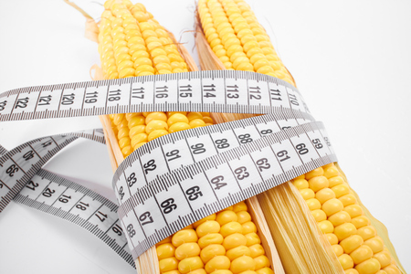 fresh corn with measuring tapeの写真素材