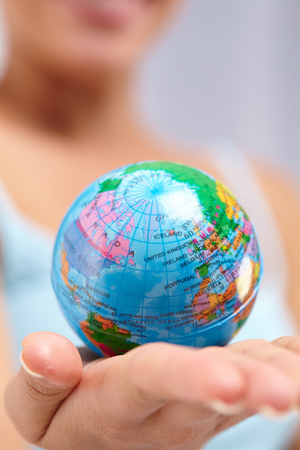 woman's hand with globeの写真素材