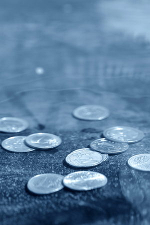 coins under waterの写真素材