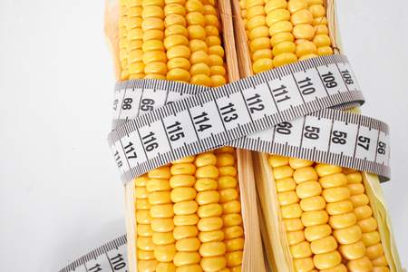 fresh corn with measuring tapeの写真素材