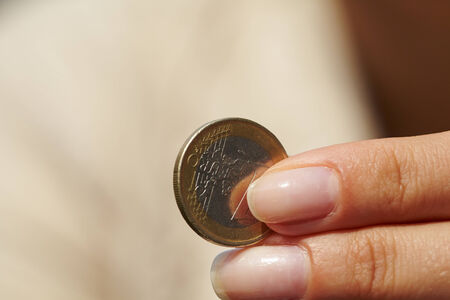 woman handing coinsの写真素材