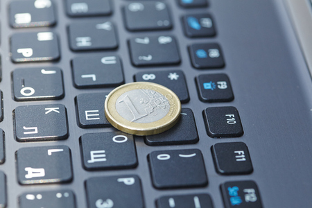 coin on laptopの写真素材