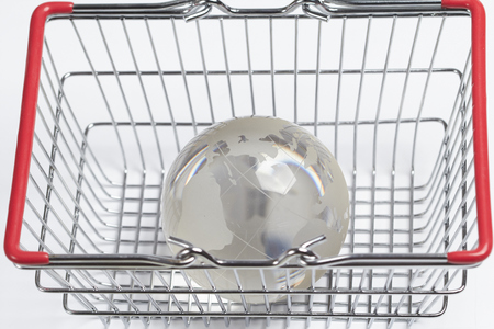 glass globe in the shopping basketの写真素材