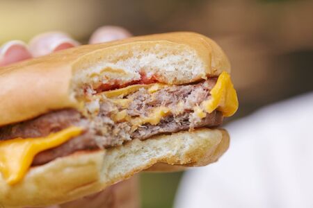 woman eating hamburgerの写真素材