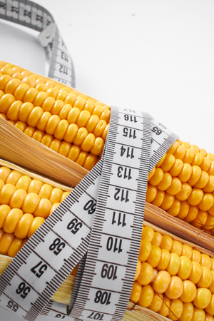 fresh corn with measuring tapeの写真素材