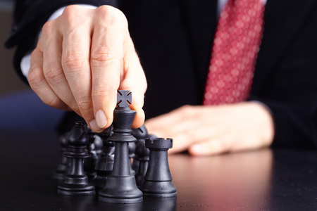 businessman playing chess gameの写真素材