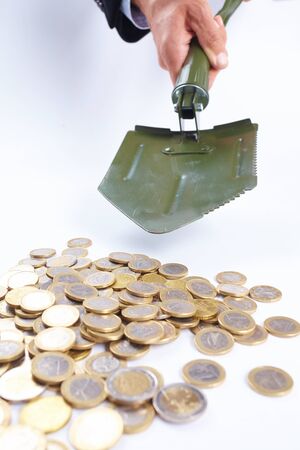 shovel with moneyの写真素材