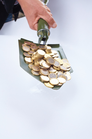 shovel with moneyの写真素材