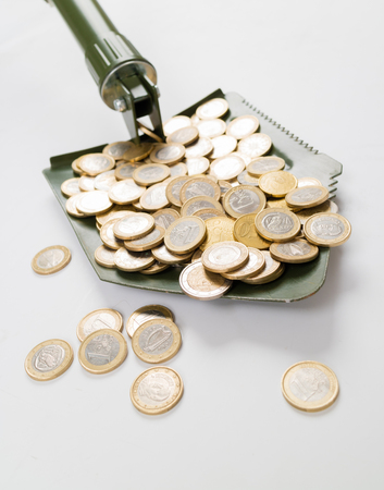 Shovel up moneyの写真素材