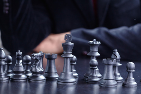 businessman playing chess gameの写真素材