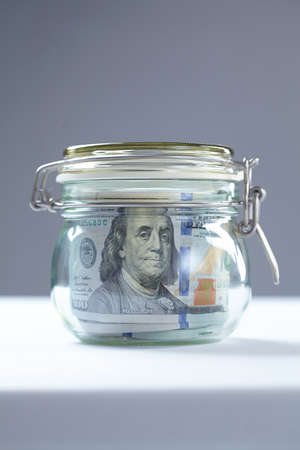 money in glass jarの写真素材