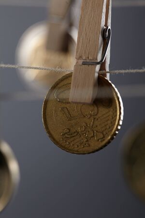clothespins with coins