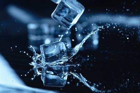 ice cubes with water splashの写真素材