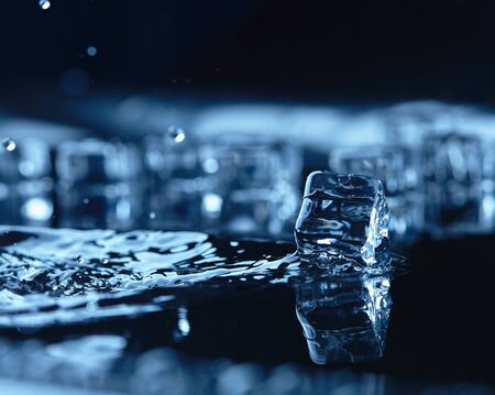 ice cubes with water splashの写真素材