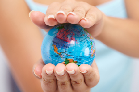 woman's hand with globeの写真素材